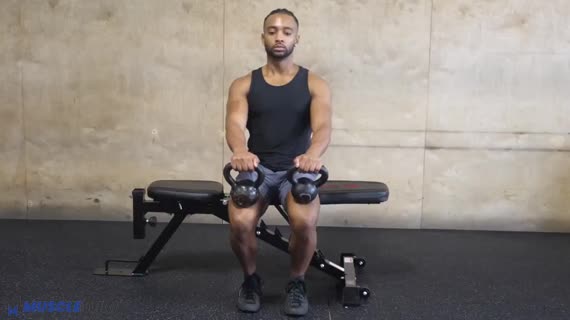 MuscleWiki Kettlebell Seated Calf Raise Double Calves